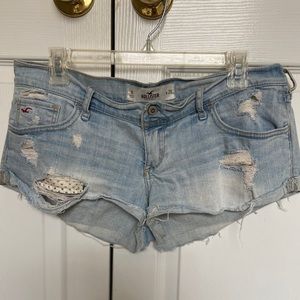 Super distressed light denim shorts